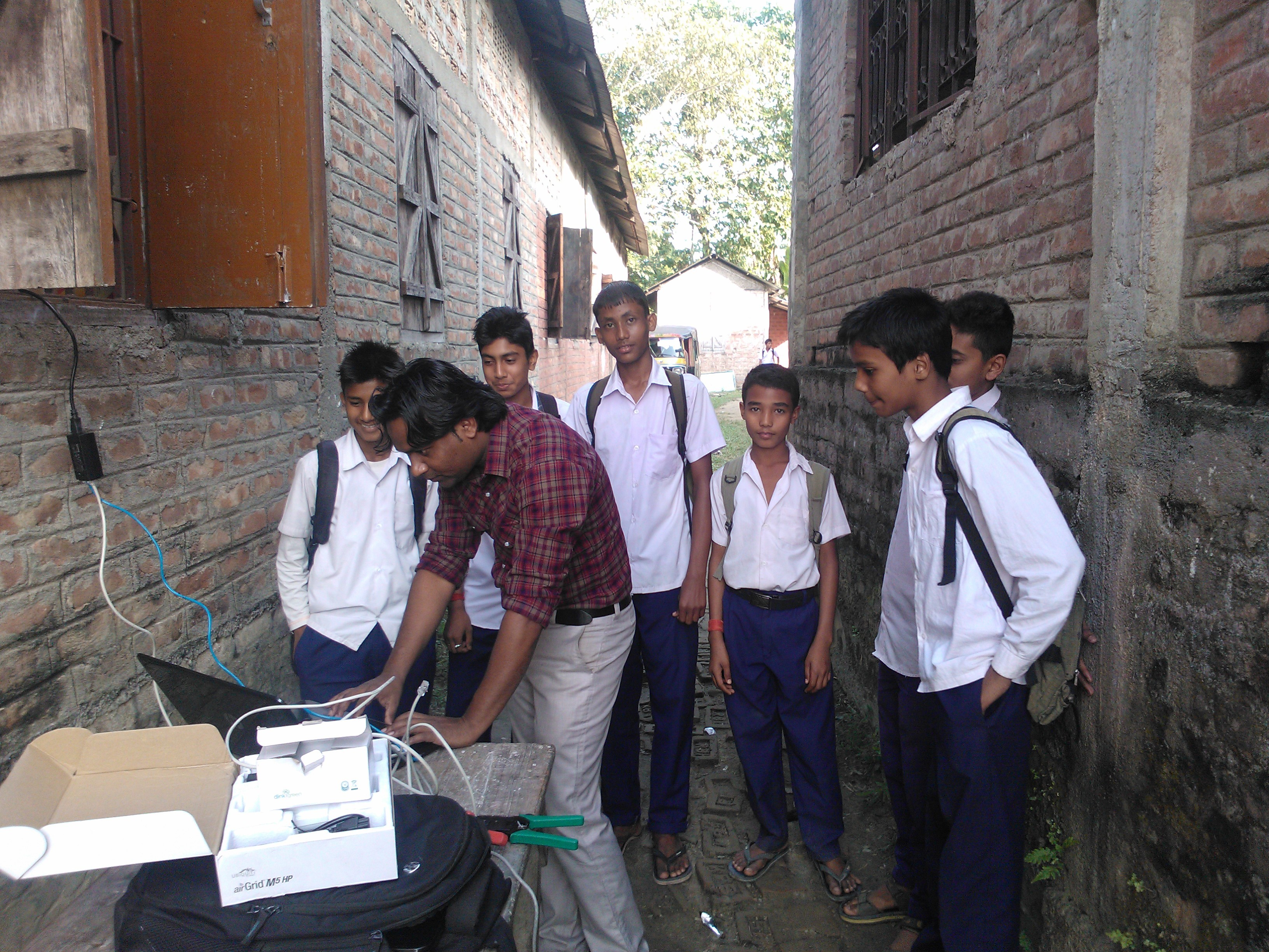 Mudassir teaching computing to rural school children