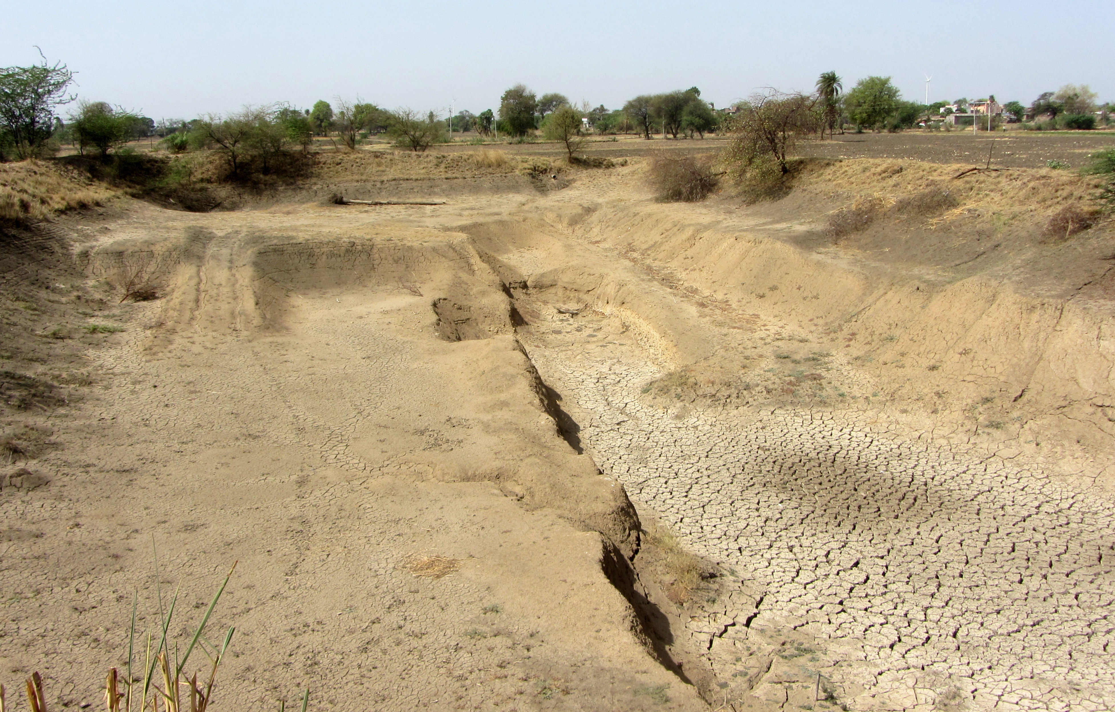 Farm pond of Singhs in the process of being deepened at Harnawada. 