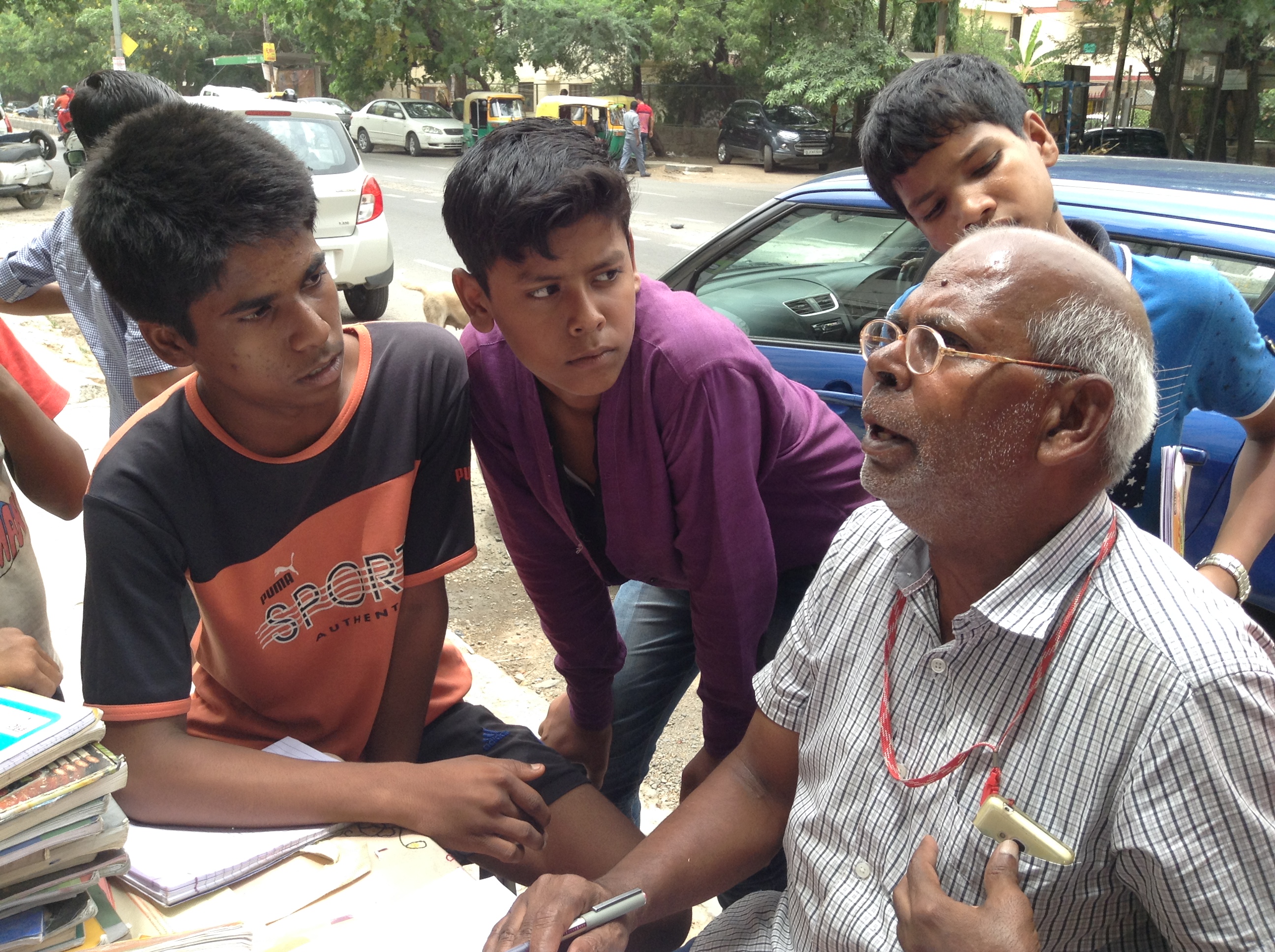 Uncleji teaches from his heart and the children listen intently