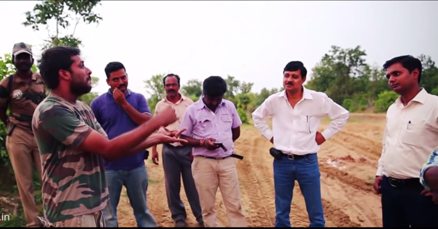 Hans working with forest officials