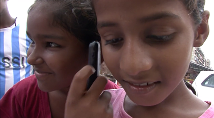 Children in Dharavi using the Hello, Seekho service