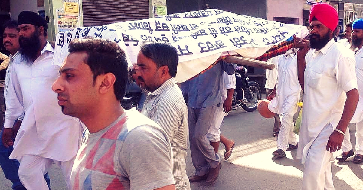 Draped in a Shroud That Covered His Son’s Body, a Father Is Protesting against Drugs in Punjab
