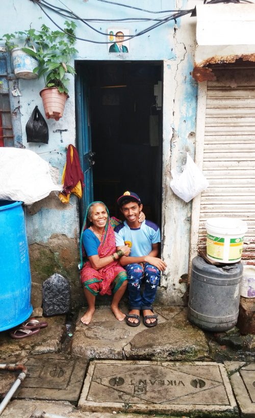 Nitin with his grandmother, outside their house.