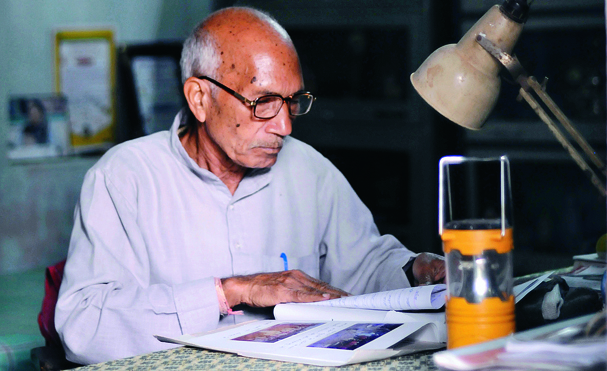 busy in one of his daily routine after prayer he comes to his office to check letters and to read newspapers.