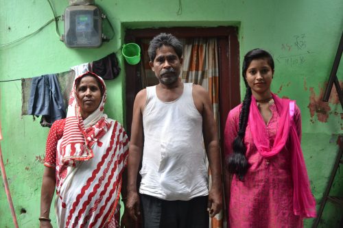 Nameen with her parents.