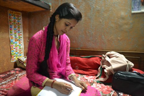 Nazmeen loves her books and notebooks.