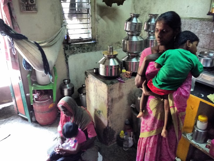 Sonali, with her children and her mother-in-law.