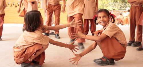 Differently abled girls playing together