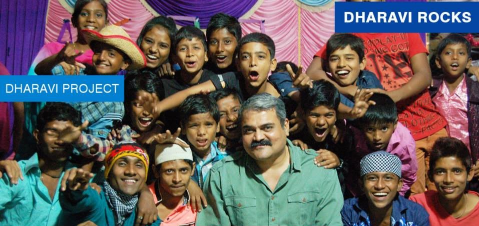 Vinod Shetty with the children of Dharavi Rocks band