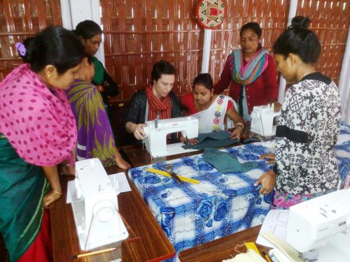 American designer Kristine Gottilla with women artisans at Bokakhat.