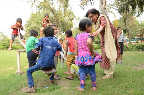 Meena playing with the children