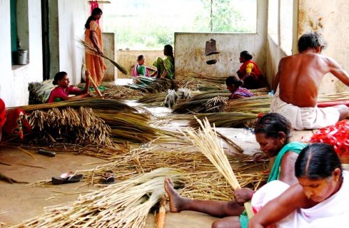 Women members of Ama Sangathan get together to make the brooms. (Credit: Abhijit Mohanty\WFS)