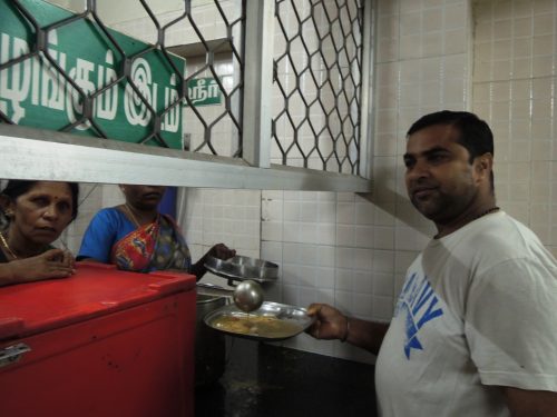 Women serve customers with a smile. (Credit: Tripti Nath\WFS)