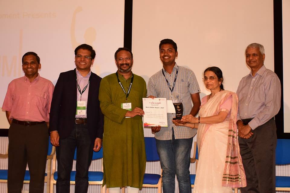 Niranjan Karagi receiving an award for Nirnal