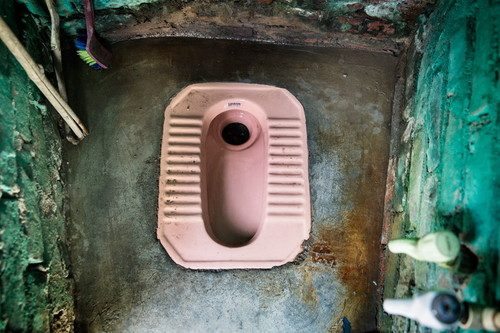 A household toilet in Safeda Basti slum, New Delhi, India. Photo Credit: WaterAid/Adam Ferguson