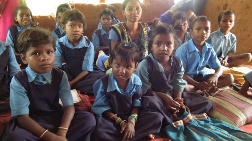 Teacher Alma Baig with the children