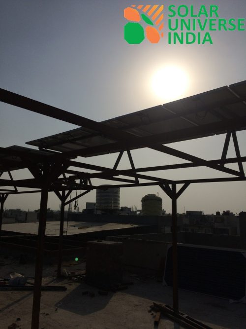 Sun Shine brights atop a Solar System erected on top of an elevated structure from ground level
