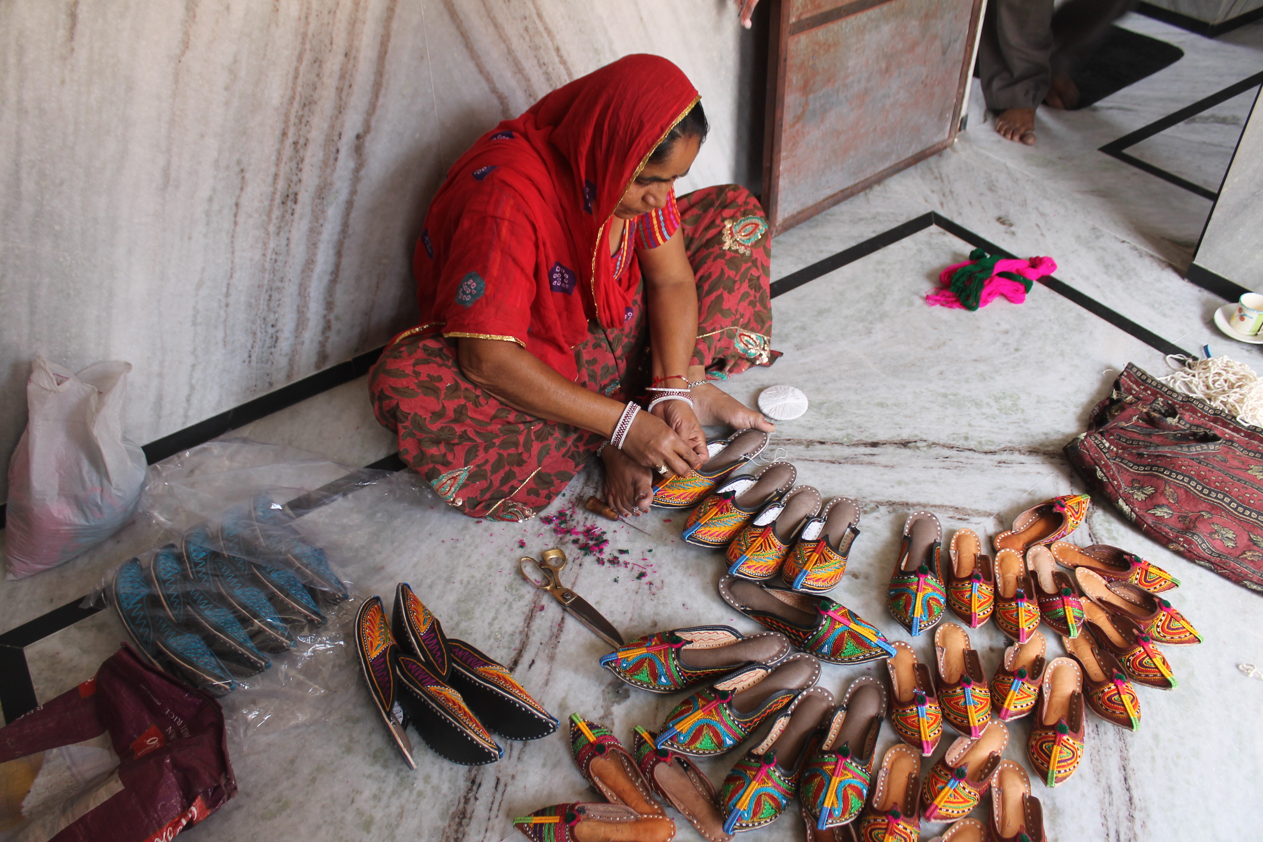 The last touch before packing the Jodhpuri chappals, out for sale