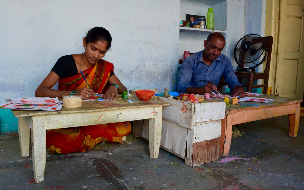 Artists at work creating Cheriyal Paintings 