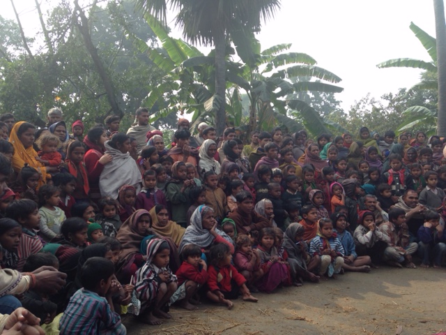 The village community in rapt attention 