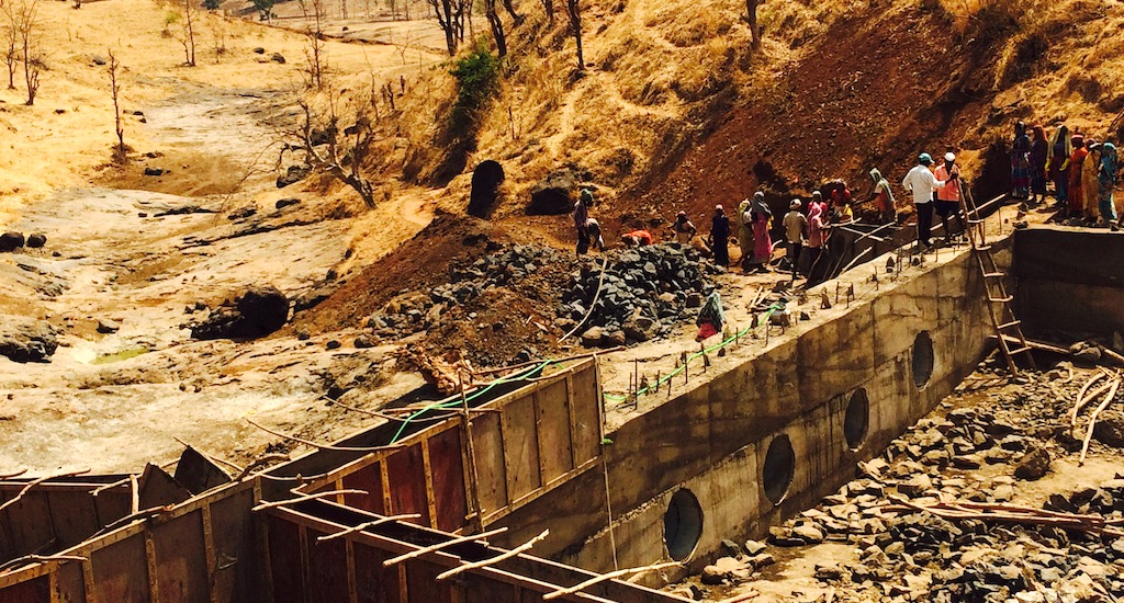 Residents of Bhetwadi contributed voluntary labor to construct the concrete bund with vents. (Photo by Nidhi Jamwal)