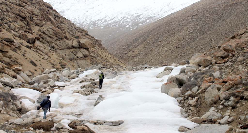 The artificial glacier melts and flows towards Nang village in May, fulfilling the village’s water needs. (Photo by Samten Choephel)