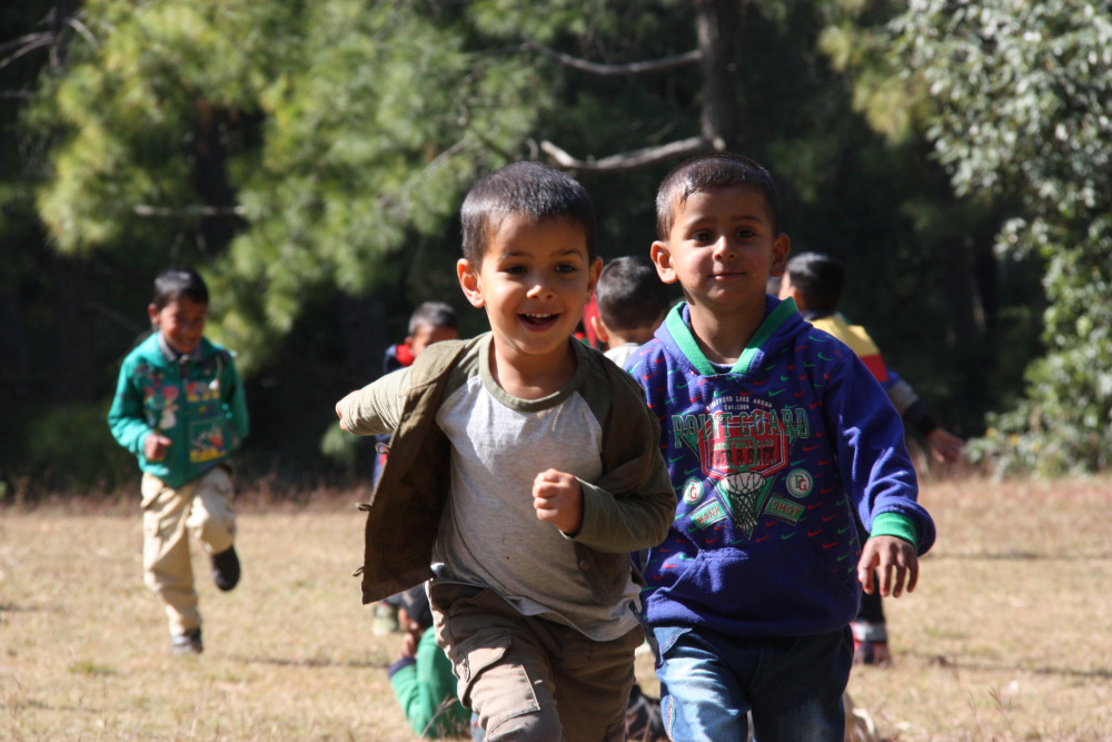 Pre-school children enjoying their picnic. (Source: Chirag School)