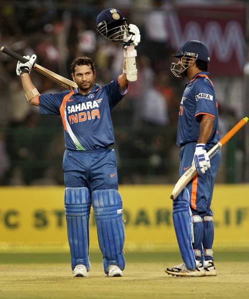 Sachin Tendulkar raising his bat after reaching that milestone. (Source: Facebook)