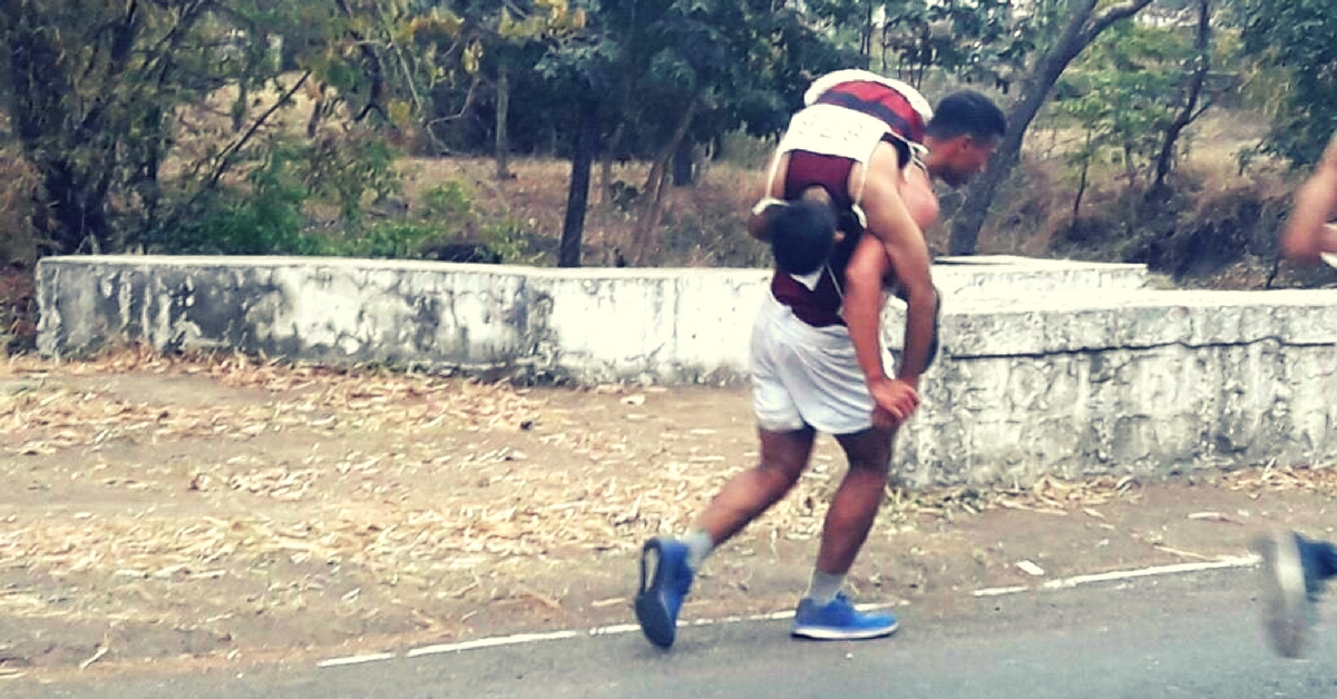 Chirag Arora carried his teammate on his back, and crossed the finishing line. Image Courtesy:- Twitter.