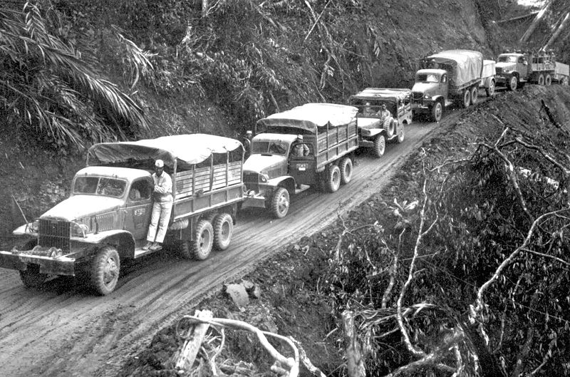 U.S-built Army trucks wind along the side of the mountain over the Ledo supply road. (Source: Wikimedia Commons) 