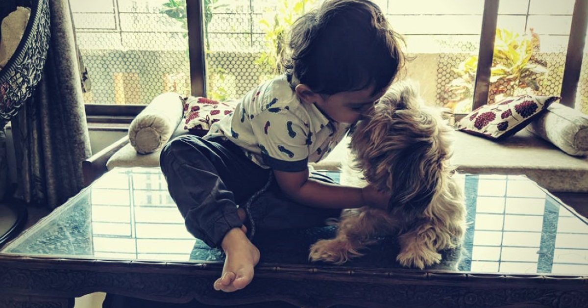 A dog is the best friend a child can ever have! Image Courtesy: Paws, We Care.