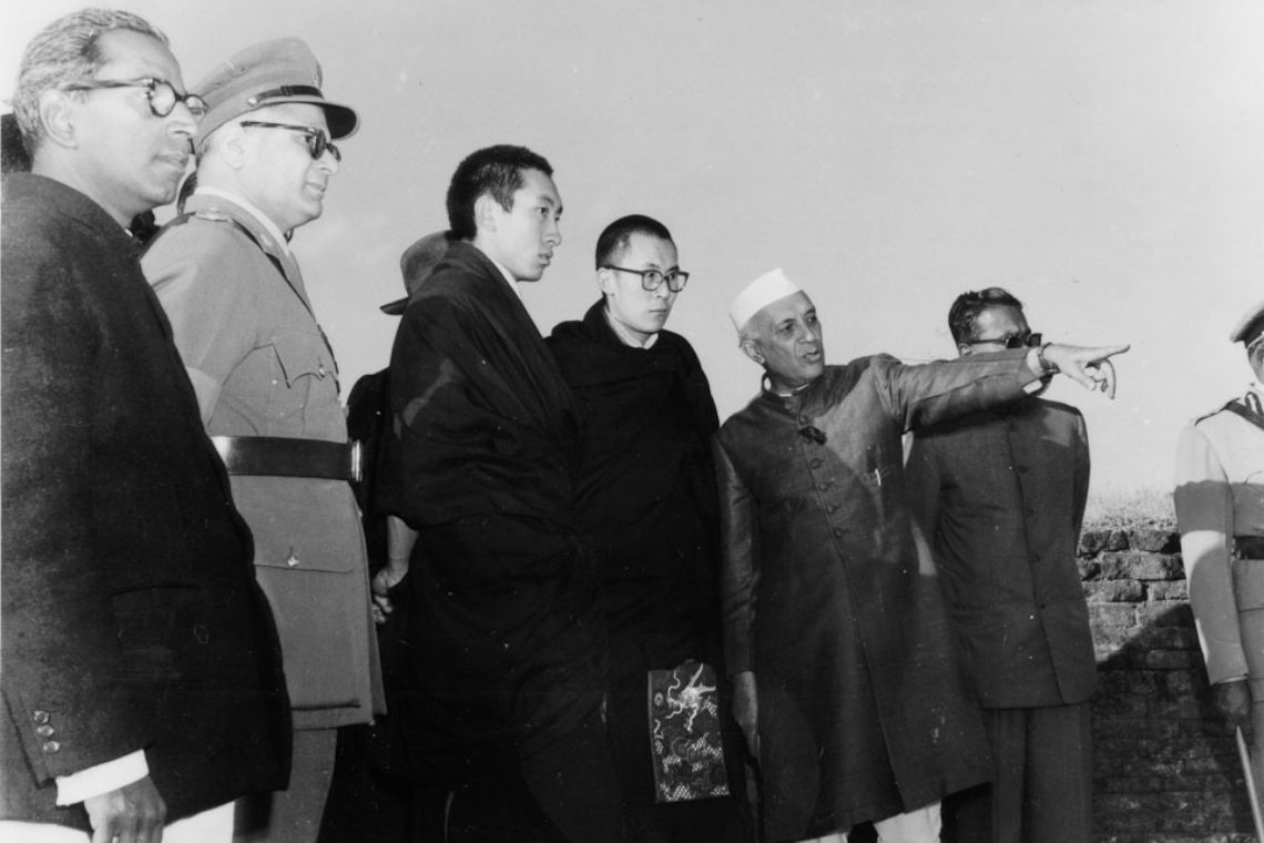 Prime Minister Nehru pointing out a landmark to HH The Dalai Lama and the Panchen Lama. (Source: dalailama.com)