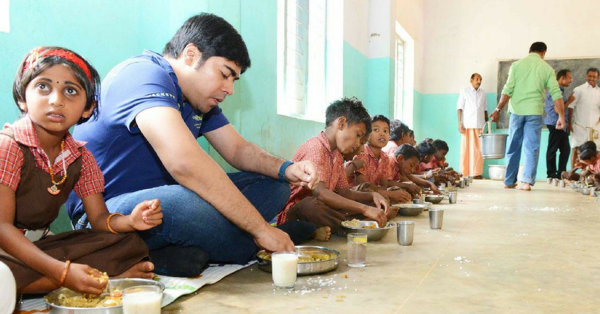 Wayanad District Collector Suhas sharing a meal with children at one of the tribal schools. For representational purposes only. Courtesy: Wayanad District Administration.