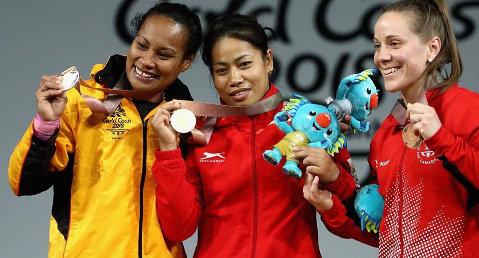 Sanjita Chanu standing with her gold medal in the centre. (Source: Facebook/DD)