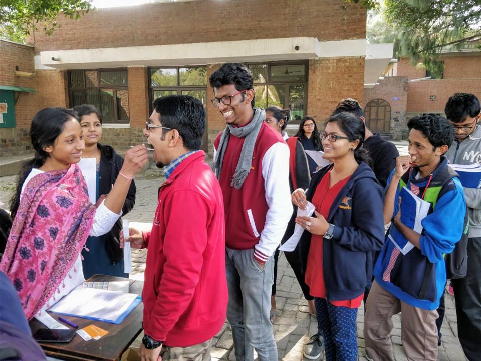 During a donor registration drive. Administering a simple cheek swab. 