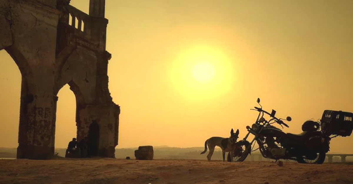 Gowtham's trusty motorcycle, and his best friend, catch the sunset, somewhere in Karnataka. Image Courtesy: Gowtham