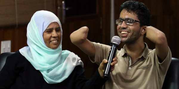 Islam Hussein with his mother. (Source: Facebook)