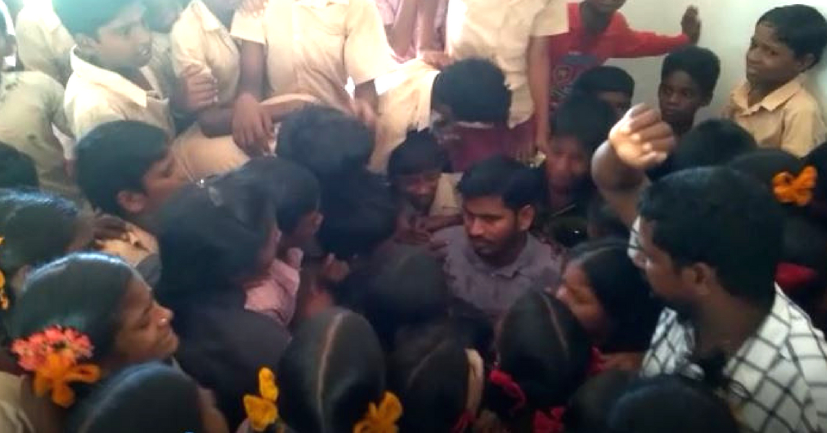 Teacher G Bhagawan surrounded by his emotional students. 