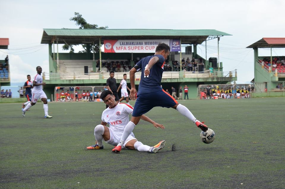 A snapshot of the MFA Super Cup. Before the MPL, there is the MFA Super Cup, where all registered club sides irrespective of divisions play each other in the months of June-July. This is a pre-season of sorts for teams in the MPL. For those interested, the final of the MFA Super Cup was later today. Following the MFA Super Cup, there is the Independence Day Cup, where teams from the MPL play yet another short knock-out tournament. Outside clubs and teams like Shillong Lajong and India Under-19 side are also invited for this tournament. (Source: Facebook/Mizoram Football Assoication)