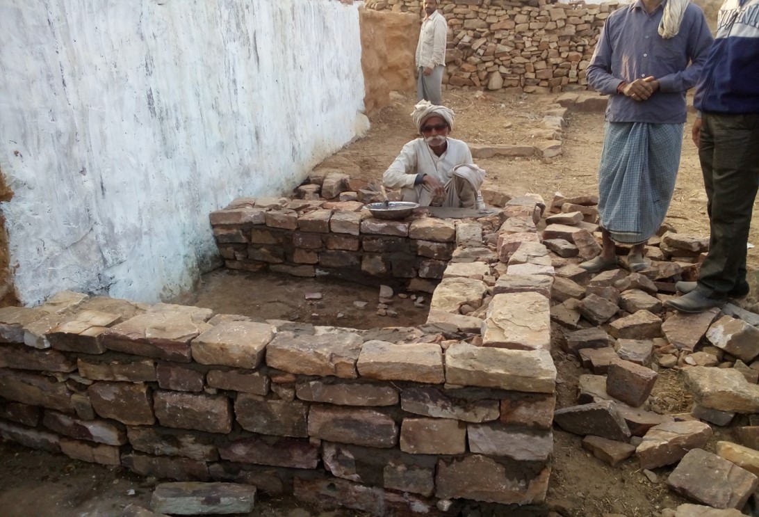 An 85-year-old mason constructing his own toilet. Inspiration. 