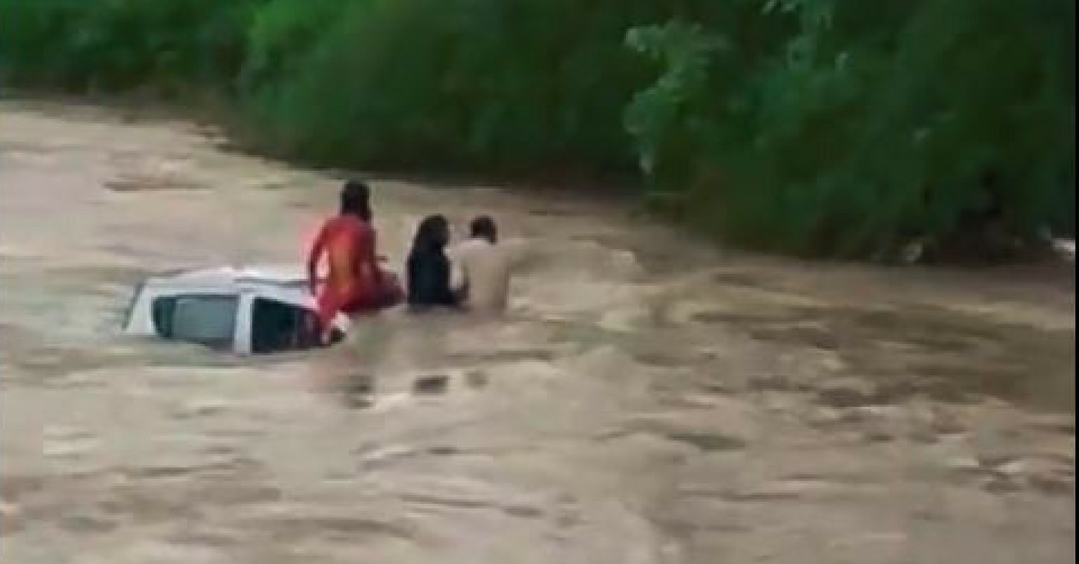 Watch: Car Falls Into Swollen River, Locals Use Rope to Rescue Family of 4