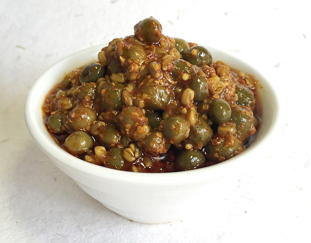 Kair ke achaar is incredibly delicious and can be relished with any Indian bread or rice.