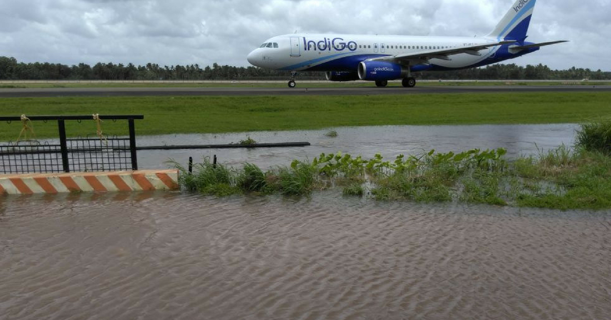 A plane stands stranded on a runway in Kerala. Image Credit: Santhosh