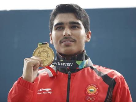 from humble beginnings: Saurabh Chaudhary standing tall with his shooting gold. (Source: Facebook)