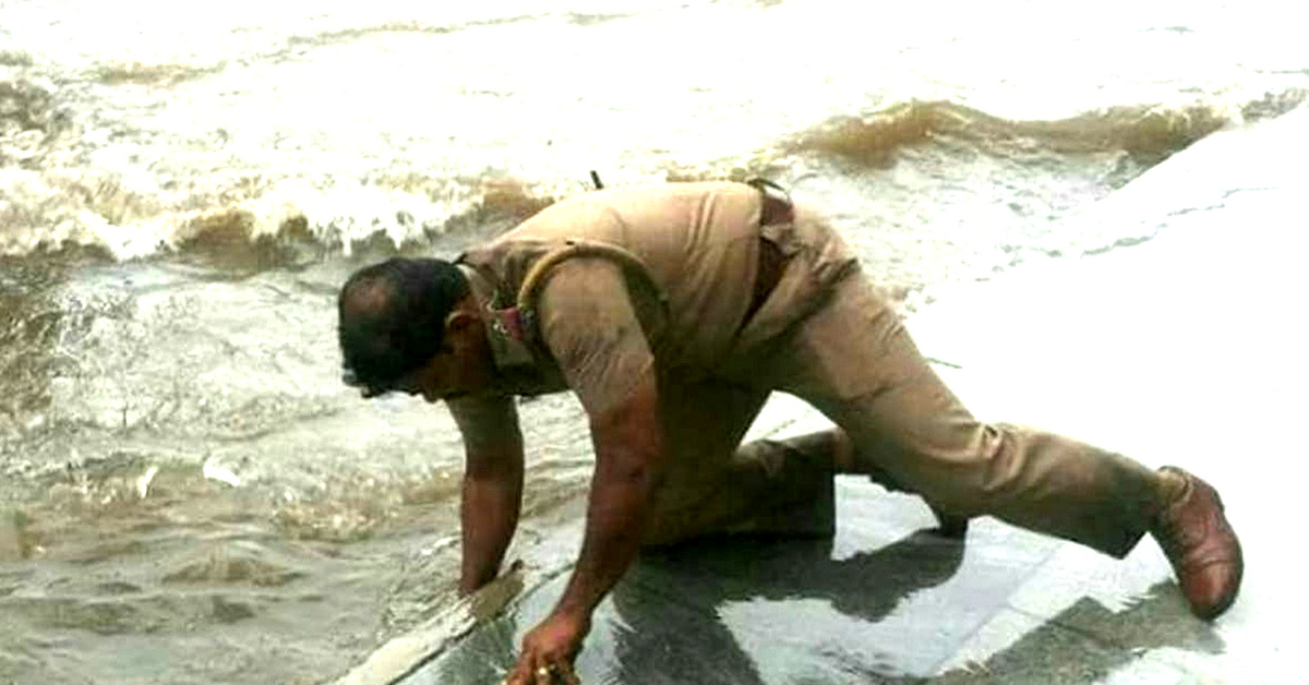 The cop in Coimbatore swam through flooded waters to reach the distressed. Image Credit: Karthik