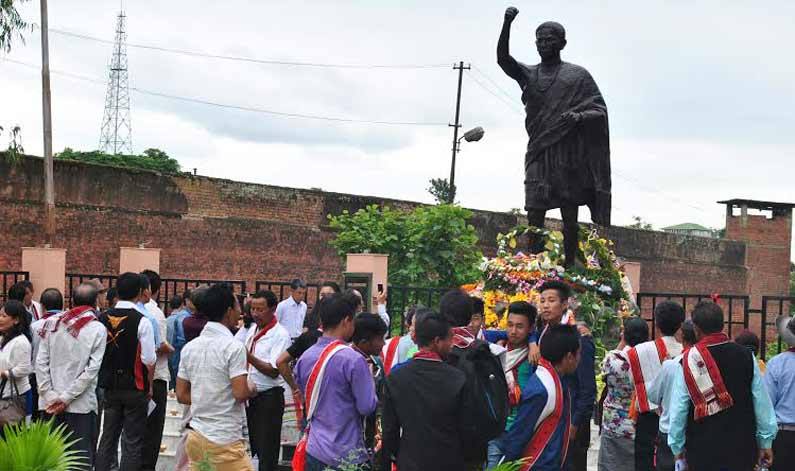 Locals standing in front of a bronze statue of Haipou Jadonang. (Source: Facebook)