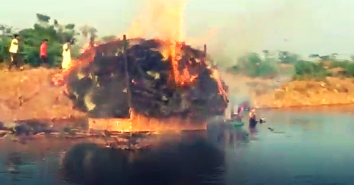 A still from the video shot by locals on the burning tractor in a village lake.