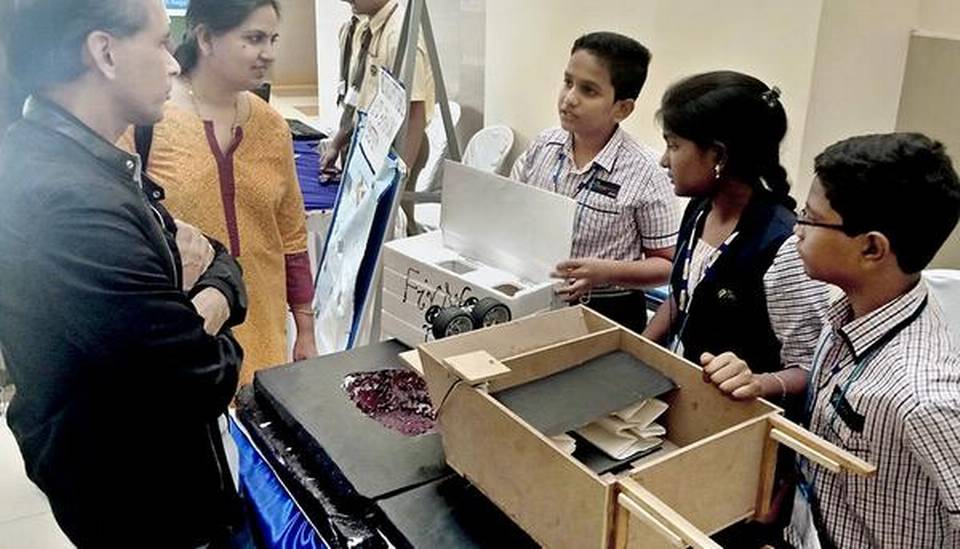 Three students of The Crossword School presenting their Pothole Warrior design. (Source: Facebook/Guntur Eye)