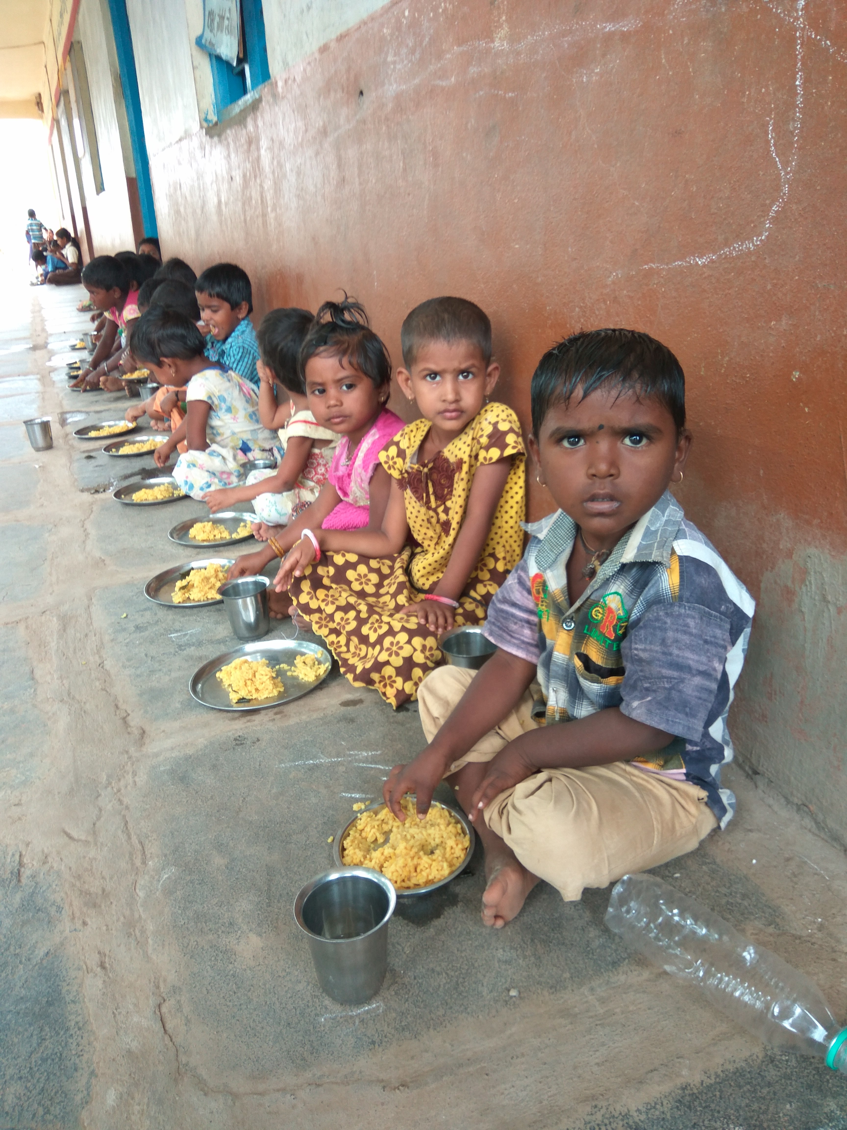 Kids having mid day meal in one of the govt. primary schools