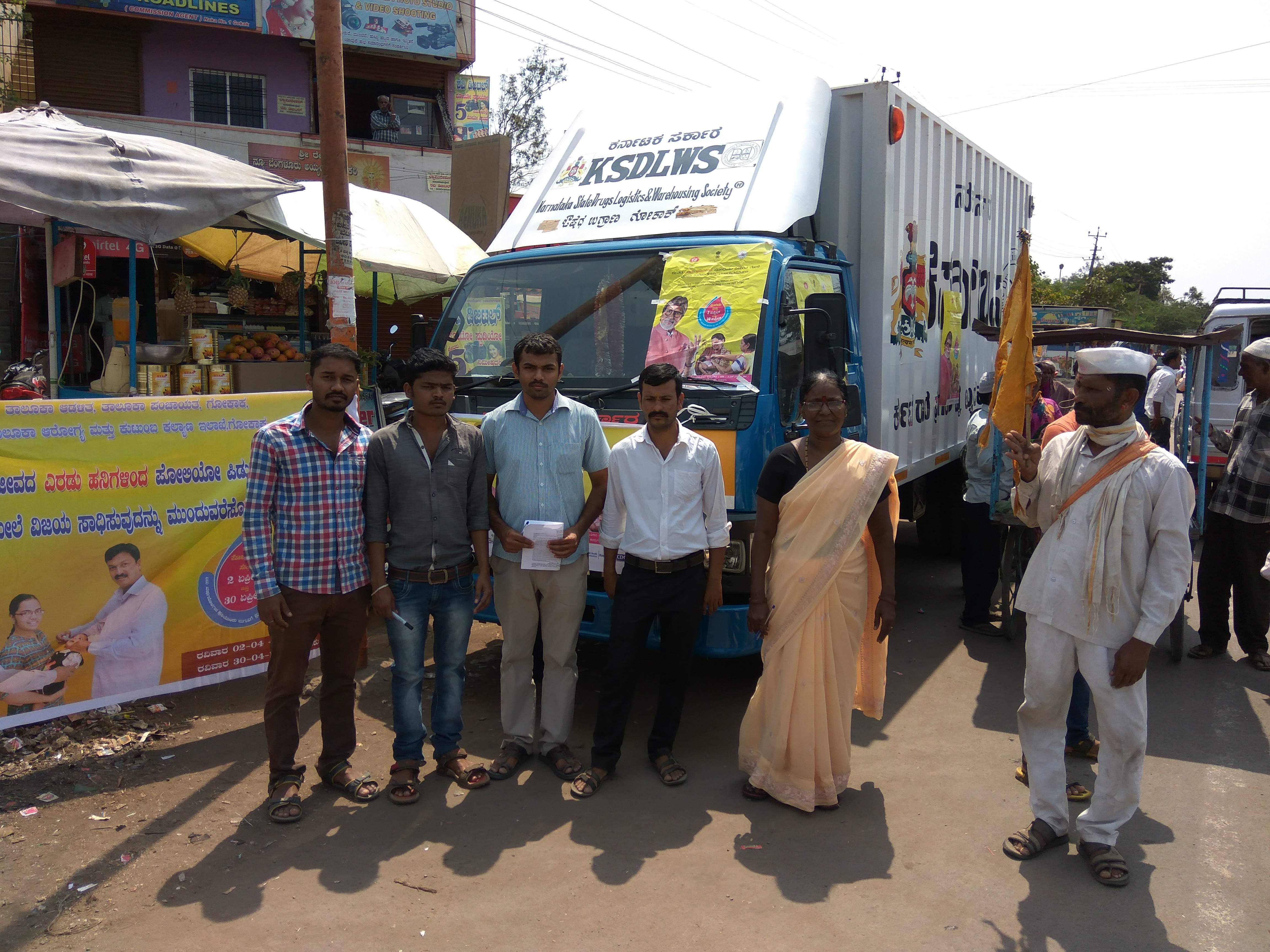 Health workers from the surveillance team on the ground standing in front of a mobile booth. (Source: Ishan Pathak)